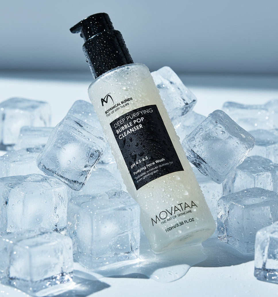 Bottle of Movataa Deep Purifying Bubble Pop Cleanser surrounded by ice cubes on a light gray background